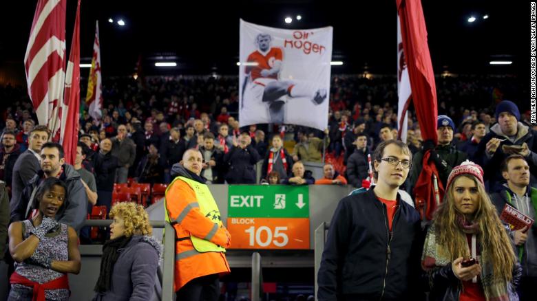 Liverpool fans on The Kop at Anfield with a banner of Sir Roger Hunt on Dec. 9, 2014. 