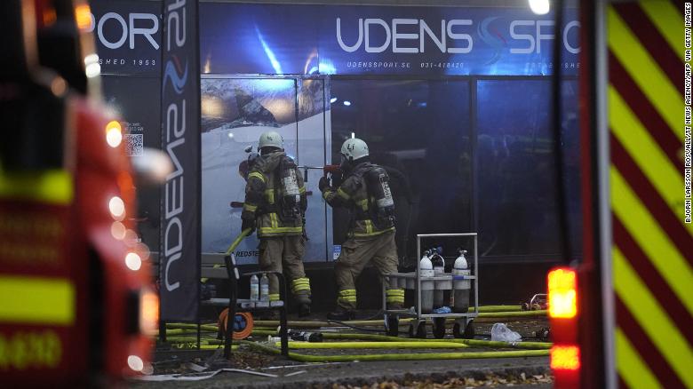 Firefighters work at the site of an explosion in central Gothenburg on September 28, 2021. 