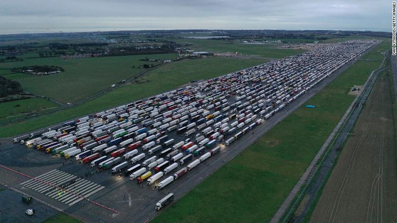 Trucks parked on the runway at Manston Airport in England waiting to cross the English Channel on December 22, 2020.