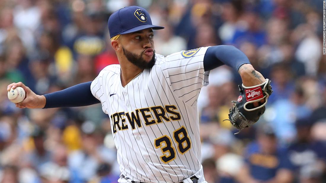 Brewers pitcher likely out for postseason after punching wall with throwing hand – CNN