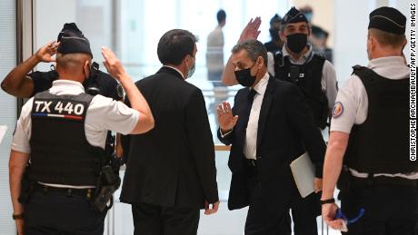 Former French President Nicolas Sarkozy (center) arrives at a hearing for the &quot;Bygmalion case,&quot; in Paris in June. 