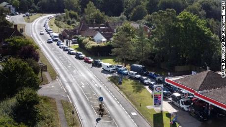 Motorists line up for fuel at a station in Ashford, England.