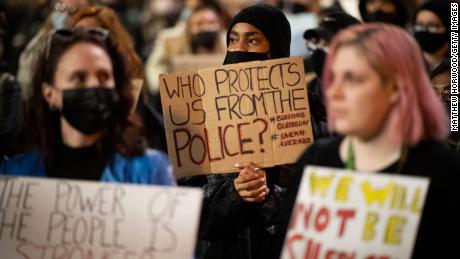 People protest violence against women and a bill that would give police greater powers in Cardiff, Wales, on March 17. 