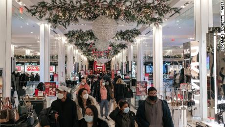 With Christmas only one day away, holiday shoppers make a last-minute trip to the Macy&#39;s flagship department store in Midtown, Manhattan on December 24, 2020 in New York City. Despite persisting social distancing recommendations and many turning to online retailers, large crowds filled the streets of New York City&#39;s commercial districts Thursday. 