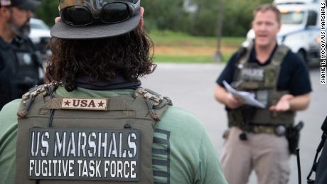 U.S. Marshals Service Metro Fugitive Task Force (MFTF) agents during the operation.