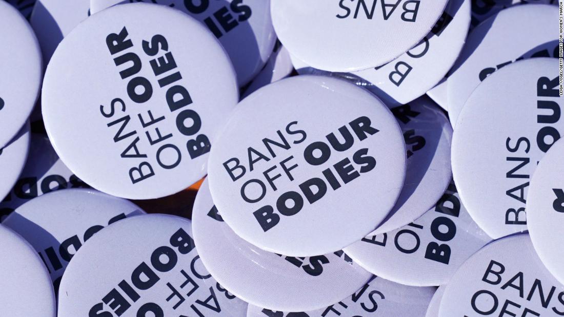 Buttons with the statement &quot;Bans Off Our Bodies&quot; are seen at a rally in Washington, DC.