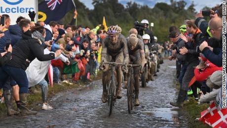 Moscon of Ineos Grenadiers competes in a rain-soaked Paris-Roubaix.