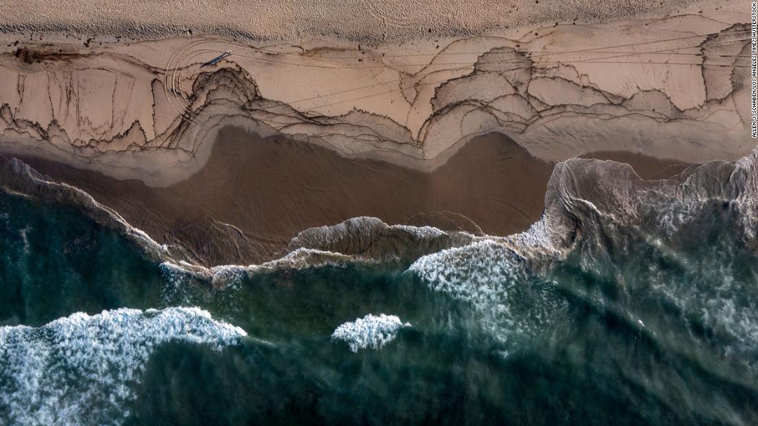 This aerial photo shows oil that has washed ashore in Huntington Beach.