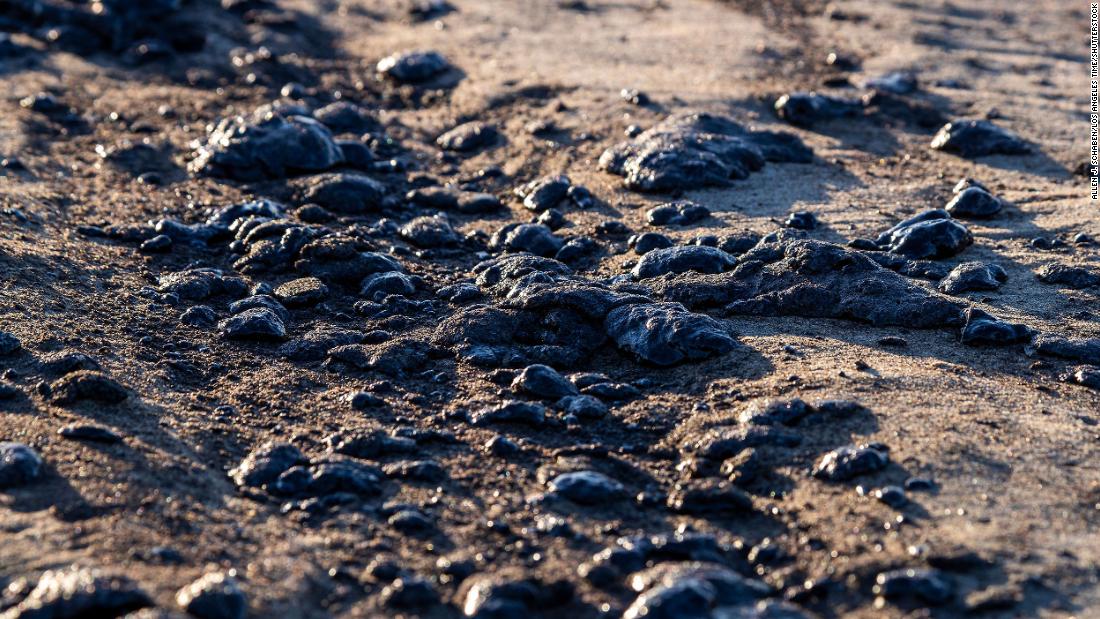 Globs of oil are seen on the border of Huntington Beach and Newport Beach on October 3.