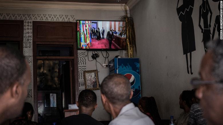 People watch the swearing-in ceremony at a coffee shop in the capital Addis Ababa.