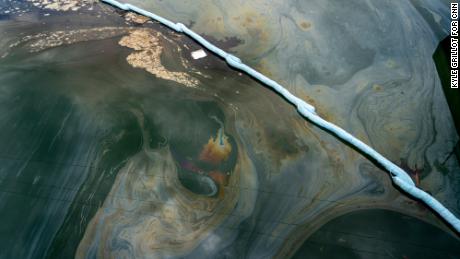 Boom traps oil under the Talbert Channel in an area affected by the oil spill off the coast of Huntington Beach, California, Monday.