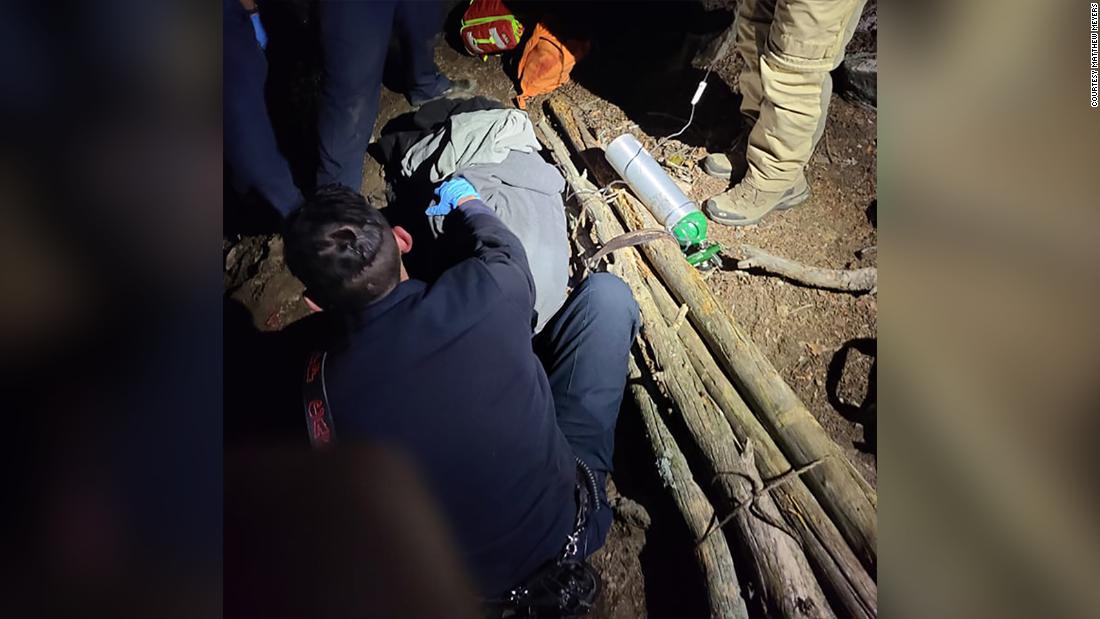 Group of bystanders builds makeshift stretcher to help rescue an injured hiker from a Colorado mountainside 