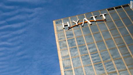 hyatt hotels sign at top of building credit card