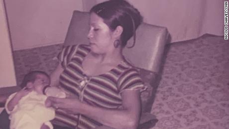 Rosie Jimenez feeds her daughter Monique, left, in an undated photo. 