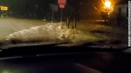 Flash flooding is seen on Rugby Avenue in Birmingham, Alabama.