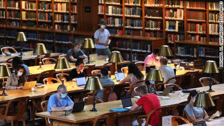 People study in the Rose Main Reading Room of the New York Public Library (NYPL) in July. Now that the library is fine-free, NYPL officials hope more patrons will feel comfortable checking out materials.