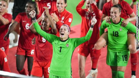 Stephanie Labbe and her Canada teammates celebrate winning in the gold medal match against Sweden.