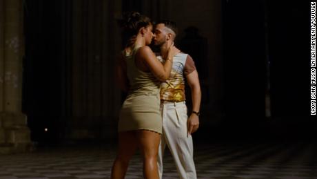 Musicians Nathy Peluso and C. Tangana dance in Spain&#39;s 13th-century Toledo Cathedral in a scene from the music video for their track &quot;Ateo.&quot;
