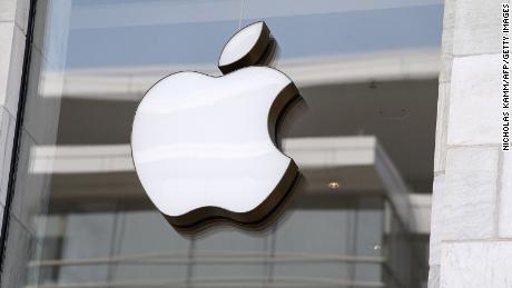The Apple logo is seen at the entrance of an Apple store on September 14.