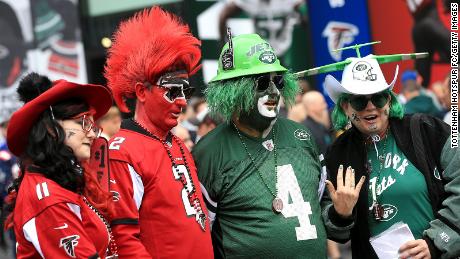 Fans arrive at the Tottenham Hotspur Stadium ahead of the NFL London match between the New York Jets and the Atlanta Falcons.