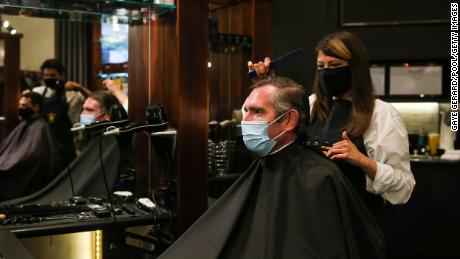 NSW Premier Dominic Berrett cuts his hair on October 11 following the easing of Govt-19 restrictions in the state.