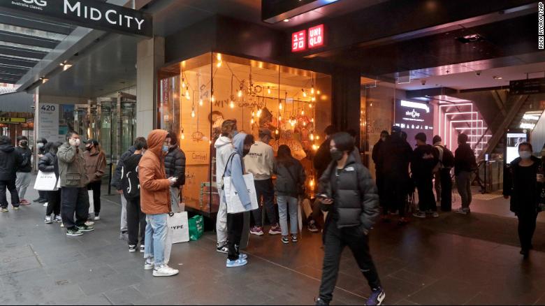 Customers line up to enter a store in Sydney on October 11 after more than 100 days of lockdown.