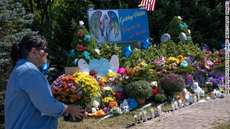 Members of the public leave flowers at a memorial site for Gabby Petito, September 26, 2021 in Blue Point, Long Island, New York. 