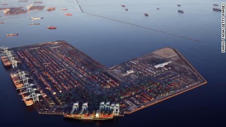 Container ships (Top R) are anchored by the ports of Long Beach and Los Angeles as they wait to offload on September 20, 2021 near Los Angeles, California. 