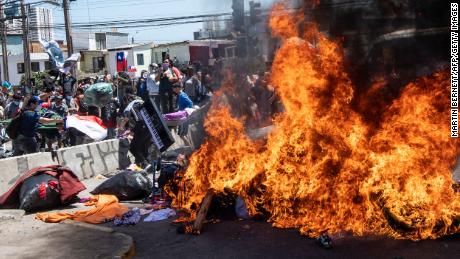 Demonstrators burn a makeshift camp for Venezuelan migrants during a protest against illegal migration in Iquique, Chile on September 25.