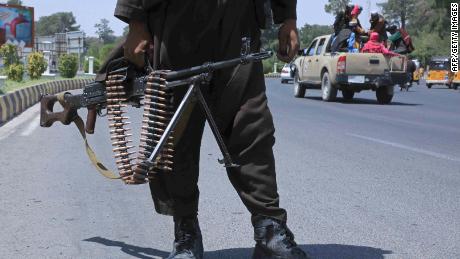 A Taliban fighter stands guard on a street in Herat on August 14, 2021.