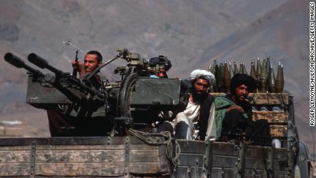 Taliban militiamen ride in a heavily armed vehicle October 10, 1996 in Kabul, Afghanistan.