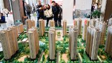On Dec. 23, 2018, Chinese home buyers study housing models of a residential property project in Hawai City, Jiangsu Province, China.