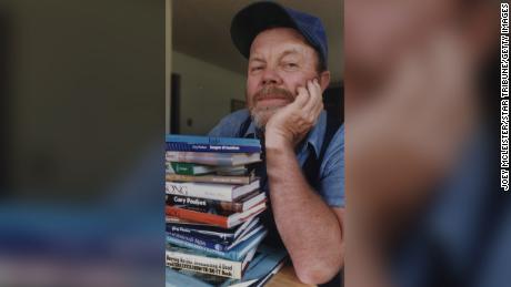 Gary Paulsen, shown with some of his books in 1988,  twice competed in the Iditarod dogsled race in Alaska.
