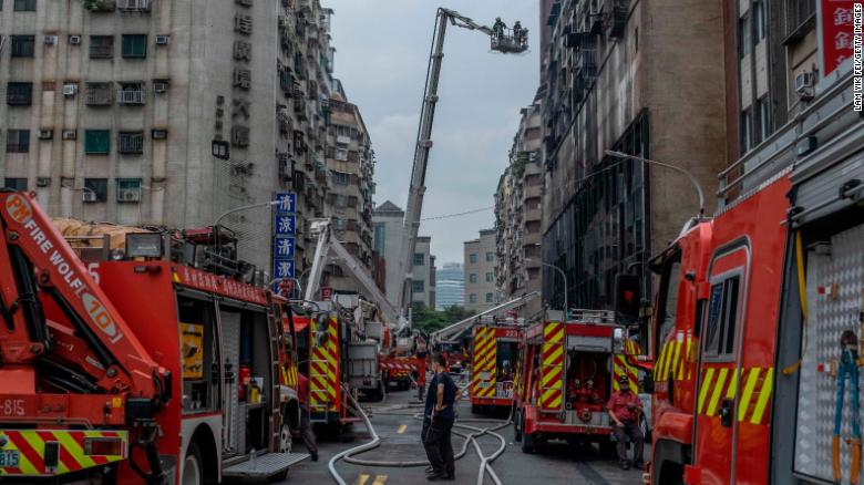 Firefighters work at the scene on Thursday.