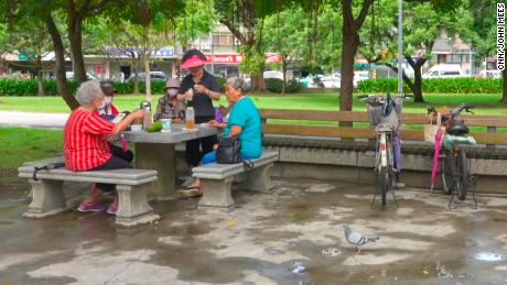 A group of older Taiwan women, including Huang and Chang, meeting up in a park in Taipei on Wednesday October 13.