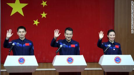 From the left, astronauts Ye Guangfu, Zhai Zhigang and Wang Yaping, meet with the press at the Jiuquan satellite launch center on October 14 before their departure to Tiangong Space Station.