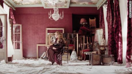 A scene from Adele&#39;s music video for &quot;Easy on Me&quot; is shown. 