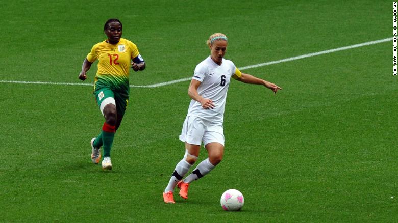 Smith is challenged by Cameroon's midfielder Francoise Bella during the London 2012 Olympics. 