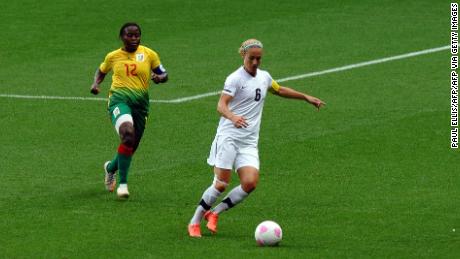 Smith is challenged by Cameroon's midfielder Francoise Bella during the London 2012 Olympics. 