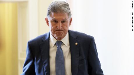 WASHINGTON, DC - OCTOBER 07: Sen. Joe Manchin (D-WV) leaves a Democratic luncheon at the U.S. Capitol October 7, 2021 in Washington, DC. Senate Democrats and Republicans have reached a deal that will temporarily raise the debt ceiling through early December. (Photo by Win McNamee/Getty Images)