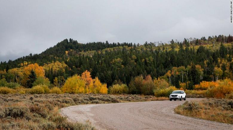 A vehicle drives in the Bridger-Teton National Forest, just east of Grand Teton National Park in Wyoming, Sunday, September 19, 2021. 