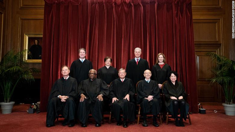 Members of the Supreme Court pose for a group photo in April. 