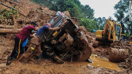 Landslides triggered by rain kill at least 21 in India