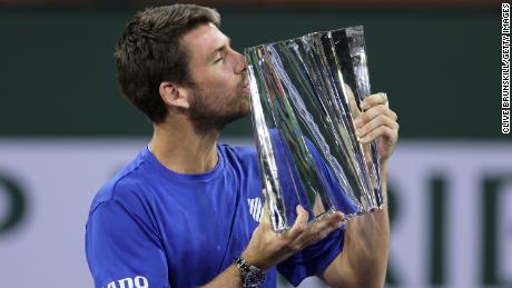 Cameron Norrie of Great Britain kisses his Indian Wells winner&#39;s trophy after a three set victory against Nikoloz Basilashvili.