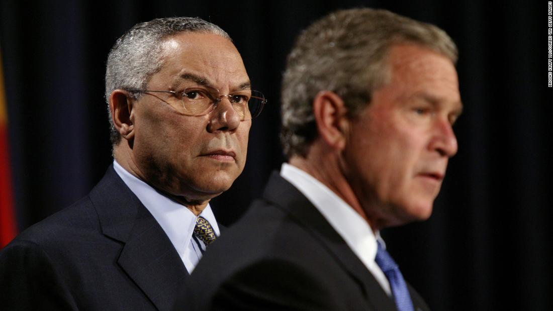 Powell stands with Bush before the President signed a $15 billion global AIDS bill in 2003.