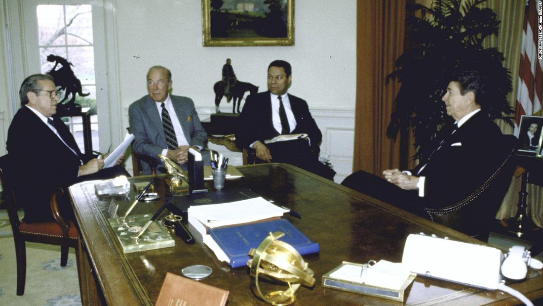 Powell became the nation's first Black national security adviser in 1987. From left here are White House Chief of Staff Howard Baker, Secretary of State George Shultz, Powell and President Ronald Reagan. They were discussing an upcoming summit with Soviet leader Mikhail Gorbachev.
