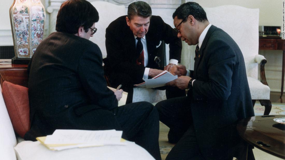 Powell advises Reagan in 1988 during an Oval Office meeting of the National Security Council.