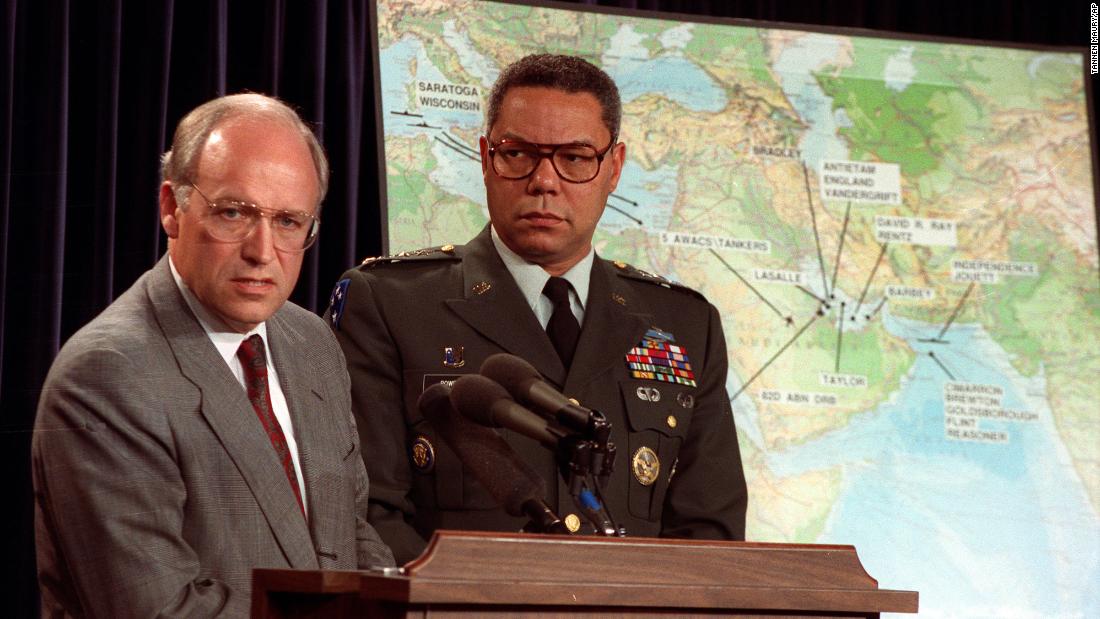 Powell and Cheney talk to reporters during a Pentagon briefing in 1990.