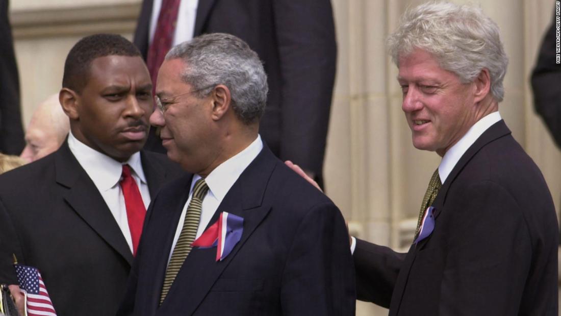 Former President Bill Clinton pats Powell's back as they depart the Washington National Cathedral in 2001. They were there on the National Day of Prayer and Remembrance, honoring those who died in the September 11 terrorist attacks.