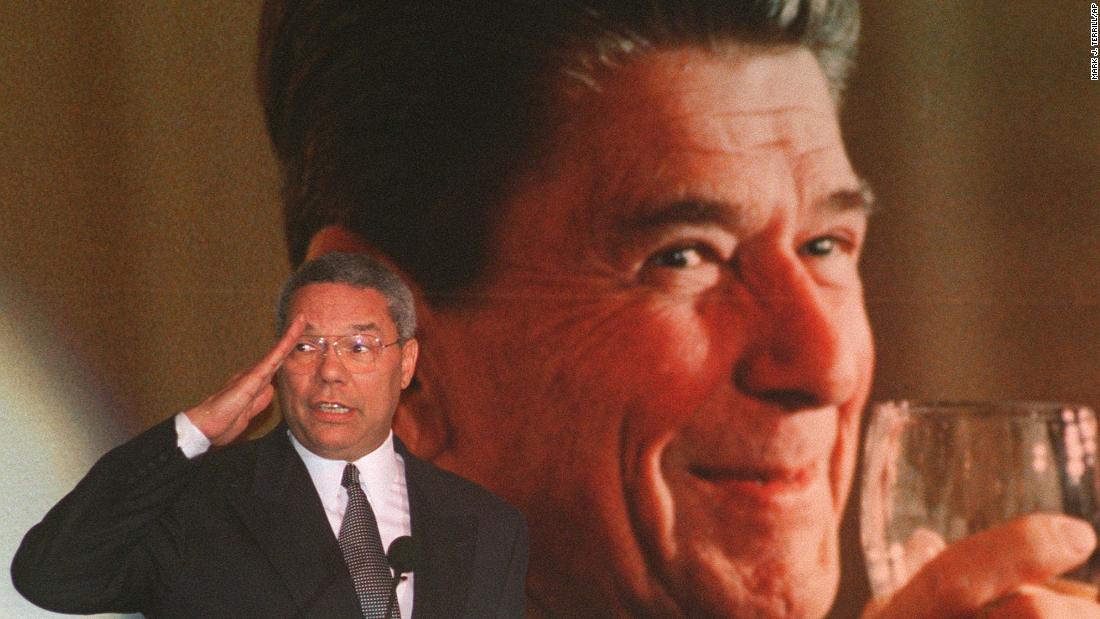 Powell salutes as he tells a story about himself and former President Ronald Reagan in 1996. He was attending Reagan's 85th birthday celebration at a restaurant in West Hollywood, California.